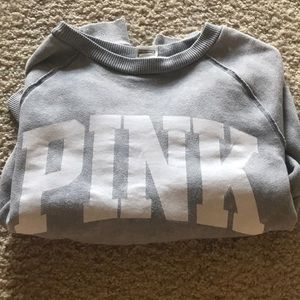 a distressed PINK sweatshirt
